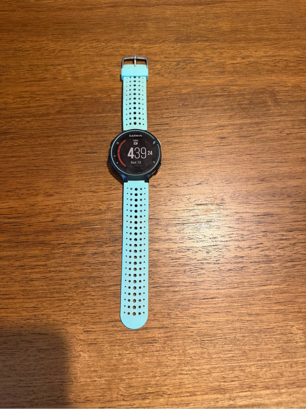 Garmin Forerunner 235 with aqua blue perforated sport band in great condition